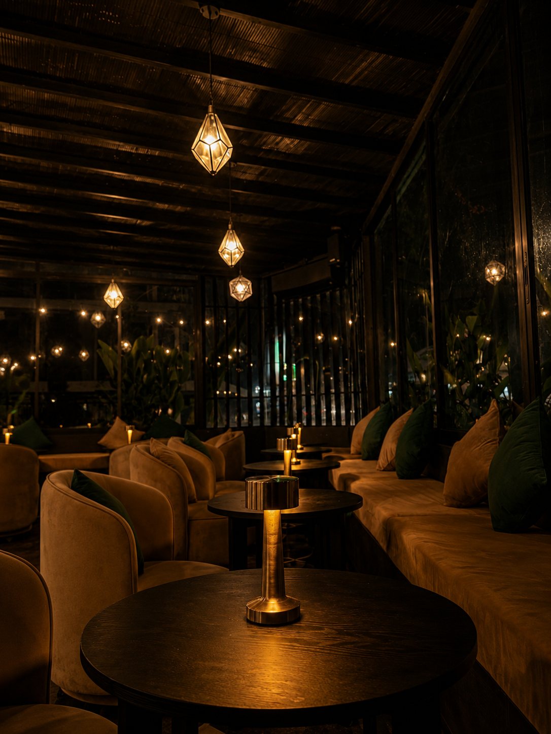 Velvet lounge chairs under lantern light
